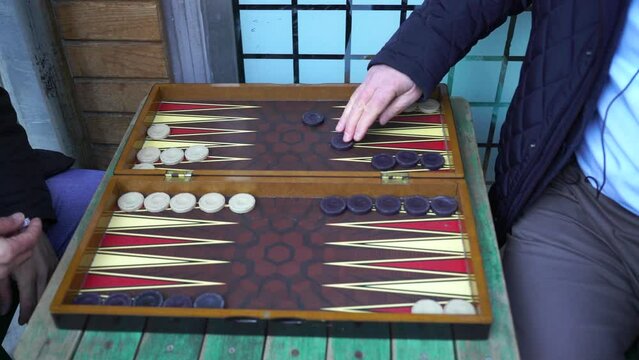 people playing backgammon