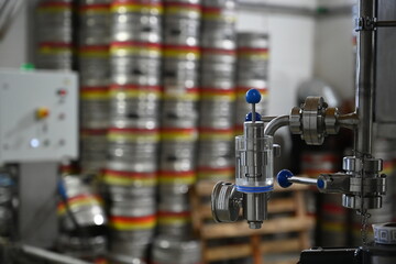 Photo of a special crane against the background of a warehouse of barrels of beer