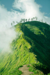 landscape with green hills and clouds