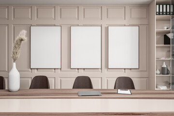 Front view on bright office interior with three white posters