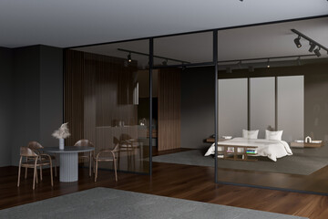 Grey hotel interior with bed and dining table, sink and glass doors