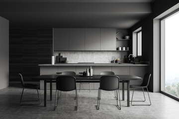 Grey kitchen interior with chairs and dining table, appliances and window