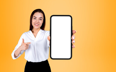 Obraz premium Businesswoman finger point with phone, mockup screen