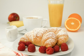 Croissants and fresh raspberries, Fresh and delicious croissants.