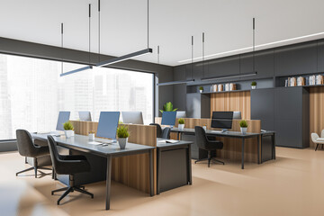 Office interior with pc computer and armchair, panoramic window with city view