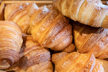 Close up of fresh croissants. Good morning breakfast concept.