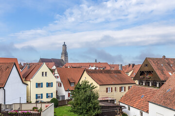 Fototapeta na wymiar Nördlingen, Germany. Tiled roofs and cathedral tower