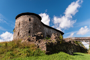Fototapeta premium Raseborg castle, a medieval castle in Raseborg, Finland in summertime with blue sky and clouds in the background.
