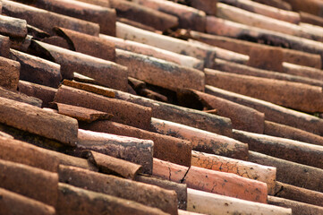 Closeup of old broken clay roof tiles