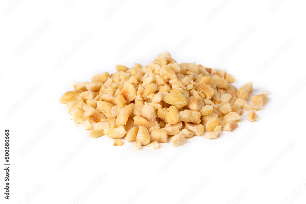 Wall mural Freshly chopped Hazelnuts as detailed close up shot isolated on white background (selective focus)