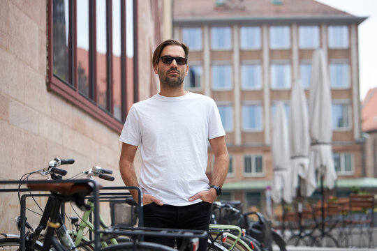 White blank t-shirt on a hipster handsome male model with space for your logo or design in casual urban style