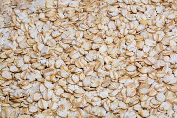 Heap of dry rolled oats isolated