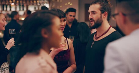 The perfect place to flex their social muscles. 4k video footage of two young women toasting with their drinks at a party.