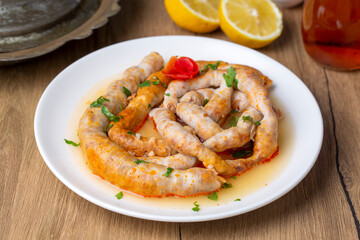 Traditional delicious Turkish cuisine, Middle Eastern dishes, offal dishes, stuffed sheep intestines (Turkish name; Mumbar dolmasi)