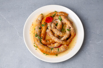 Traditional delicious Turkish cuisine, Middle Eastern dishes, offal dishes, stuffed sheep intestines (Turkish name; Mumbar dolmasi)