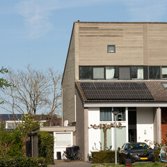 Fototapeta na wymiar Solar Panels on the roof of a family house
