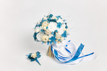 Lovely white and blue bridal bouquet on white background