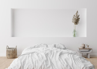 Empty white wall in modern bedroom. Mock up interior in scandinavian, boho style. Free, copy space for your picture, text, or another design. Bed, rattan basket, pampas grass. 3D rendering.
