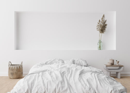 Fototapeta Empty white wall in modern bedroom. Mock up interior in scandinavian, boho style. Free, copy space for your picture, text, or another design. Bed, rattan basket, pampas grass. 3D rendering.