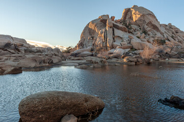 Overlooking Barker Dam in Joshua Tree National Park during golden hour.