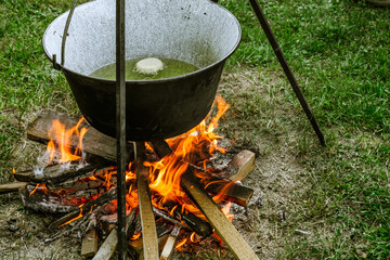 Romanian traditional food prepared at the cauldron on the open fire