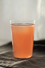 Guava drink in tumbler glass on linen cloth