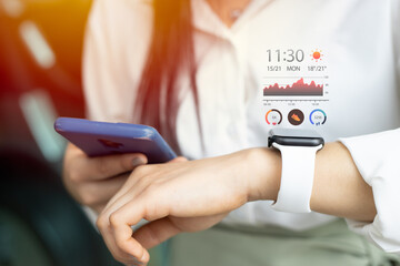 Fototapeta smartwatch with health data tracking using smartphone for modern digital lifestyle concept obraz