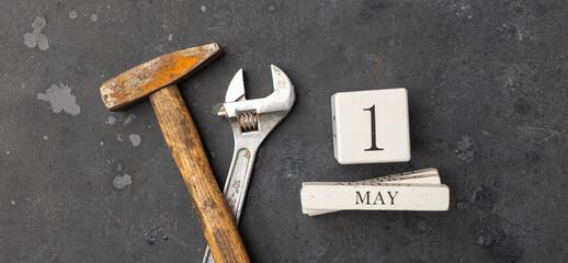 International Workers' Solidarity Day, 1 May concept, wrench and hammer with calendar date 1 may on...