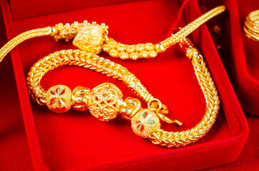 Gold Bracelet in red velvet box container.