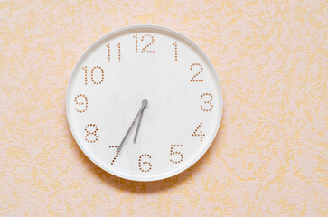 white round wall clock in the room