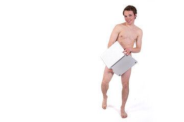 Sexy topless man with a laptop in his hands. Funny office worker on a white background. Isolate. Man in full growth.