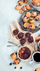 Muffins assortment on light background.