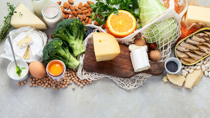 Healthy food high in calcium on light background. - obrazy, fototapety, plakaty
