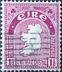 Ireland - circa 1940: a postage stamp from Ireland , showing the silhouette of the map of Ireland with ornaments and embellishments . purple