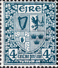 Ireland - circa 1940: a postage stamp from Ireland , showing the Coat of Arms of Ireland with...