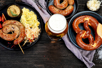 Grilled German sausages on wooden background.