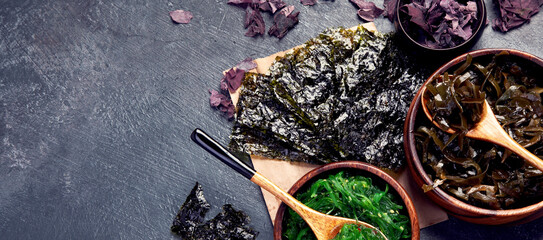 Seaweed assortment on fark background. © bit24