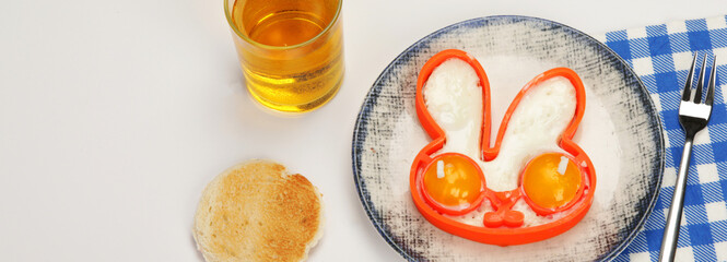 Sunny-side-up eggs for kids on colourfull background.