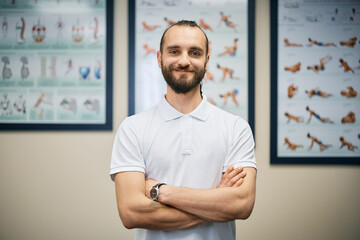 Portrait of confident professional physiotherapist looking at camera.