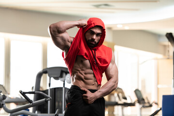 Healthy Man With Six Pack in Red Hoodie