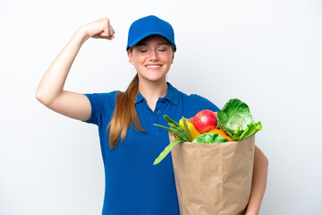 Young delivery woman taking a bag of takeaway food isolated on white background doing strong gesture