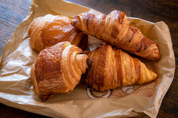 croissant and chocolate bread on a table