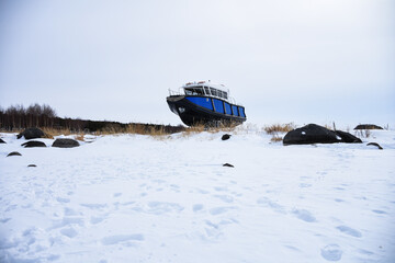 by the frozen lake cildir in ardahan turkey the boat was driven ashore