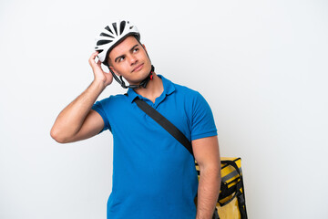Young caucasian man with thermal backpack isolated on white background thinking an idea