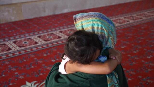 religious holidays. kissing hand 
the little girl kisses the hand of her mother's elders. Muslims kiss the hand of old people on religious holidays. Victim and Ramadan feast
