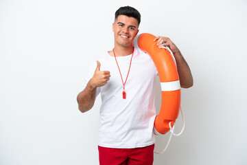 Young handsome man isolated on white background with lifeguard equipment and with thumbs up