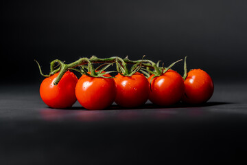 red tomatoes on a black background