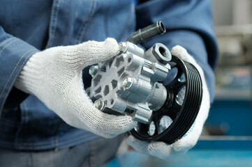 Repair and maintenance of the car in the service center.Spare parts. Power steering pump.