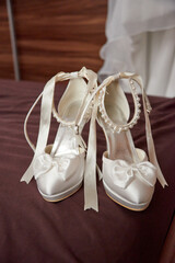 white bride shoes standing on ground