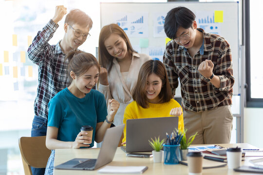 Group of young entrepreneurs who are excited and happy with the successful start of their business.